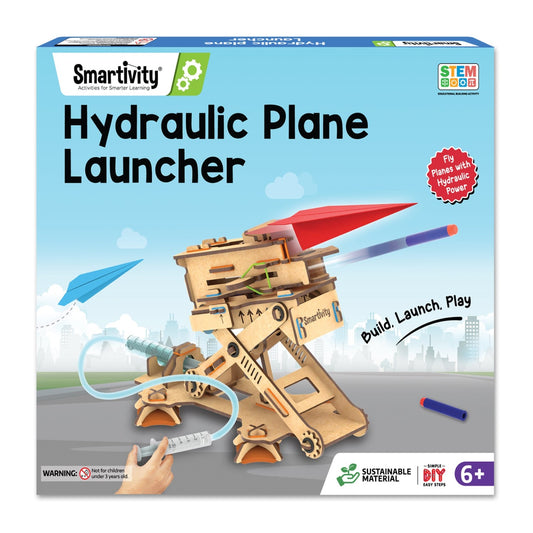 Smartivity Hydraulic Plane Launcher toy set packaging with wooden launcher and toy plane on a cityscape background.