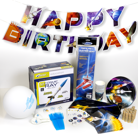 Space-themed birthday party supplies including a 'Happy Birthday' banner, rocket-themed products, and partyware on a white background.