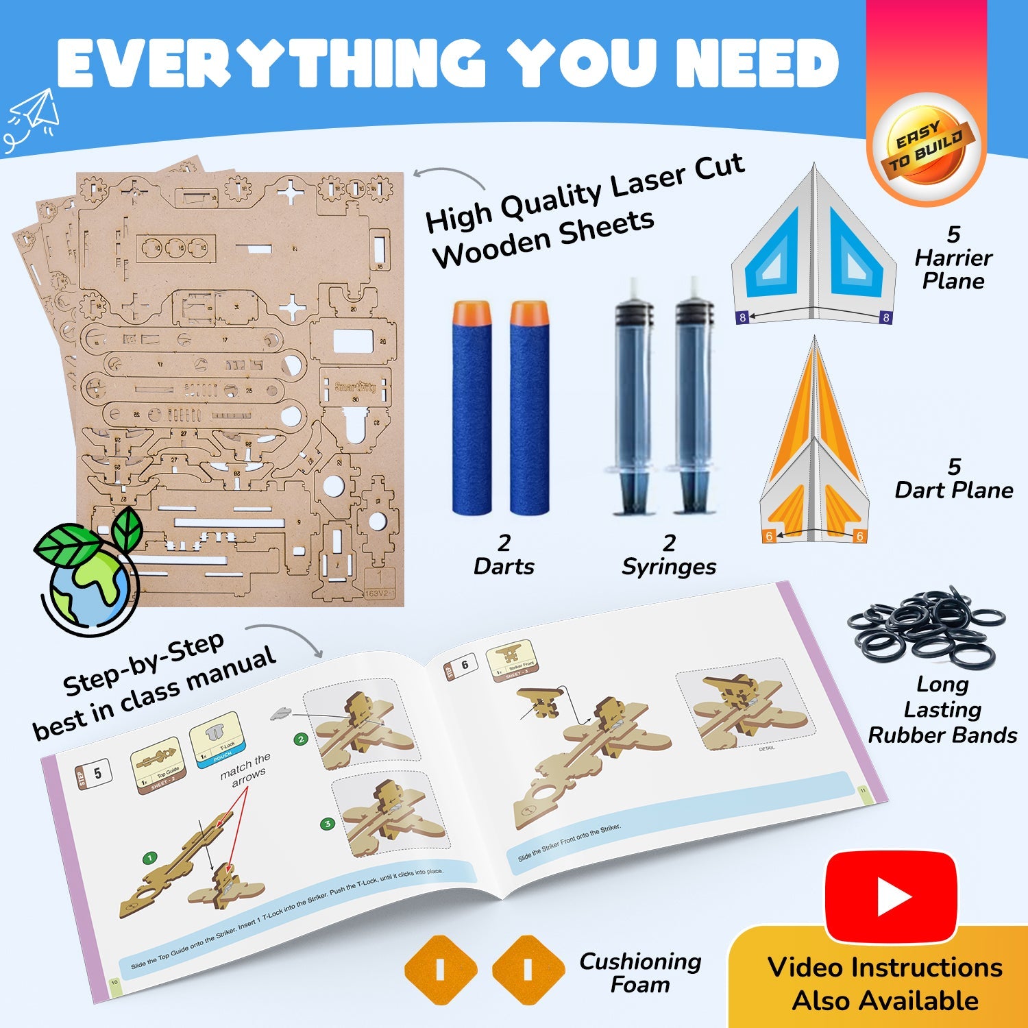 Kite-making kit with laser-cut wooden sheets, darts, syringes, rubber bands, and a step-by-step manual on a white background.